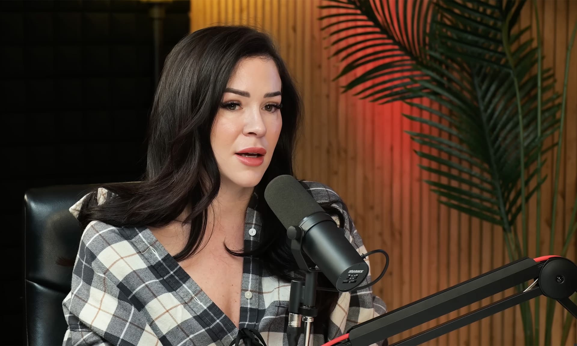 Close-up of a guest recording at the microphone